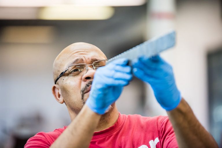 Technician checking quality of surface finish
