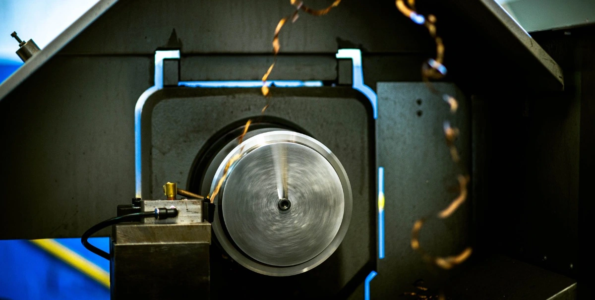 CNC lathe that used to be a manual lathe turning product at Alcon Tool in Akron